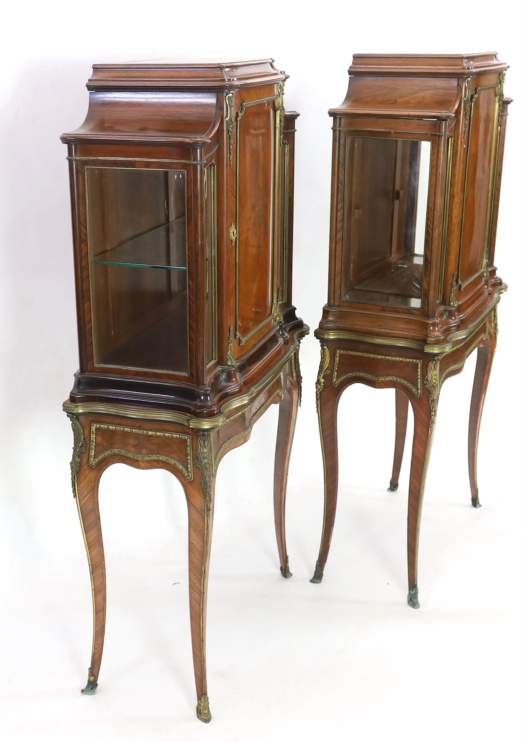 A pair of late 19th century Louis XVI style marquetry inlaid kingwood vitrines